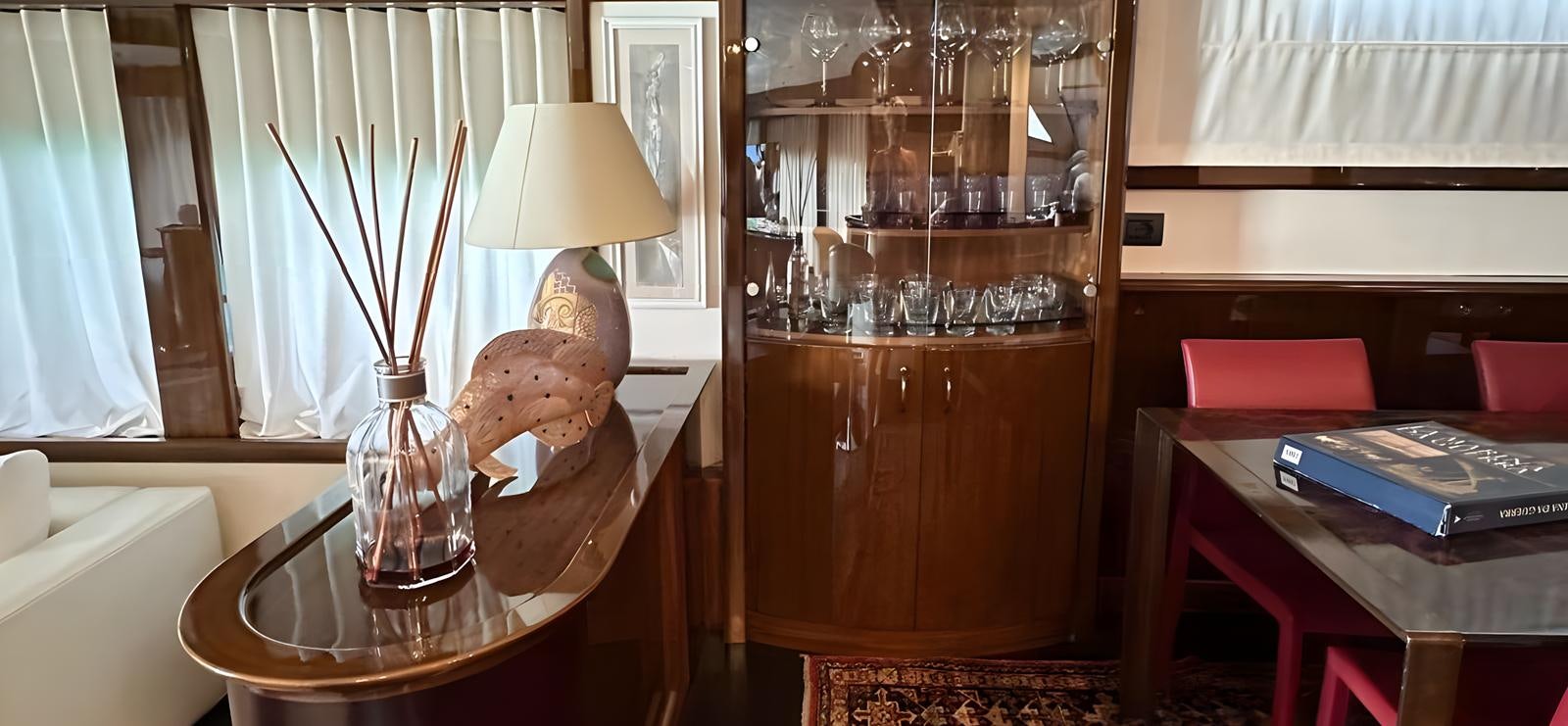 a vase with a skull on a table aboard UNICA Yacht for Sale