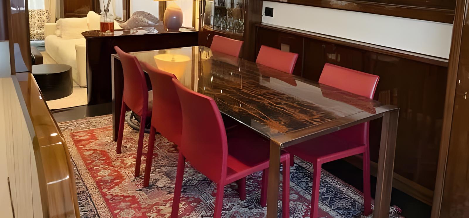 a table with chairs around it aboard UNICA Yacht for Sale