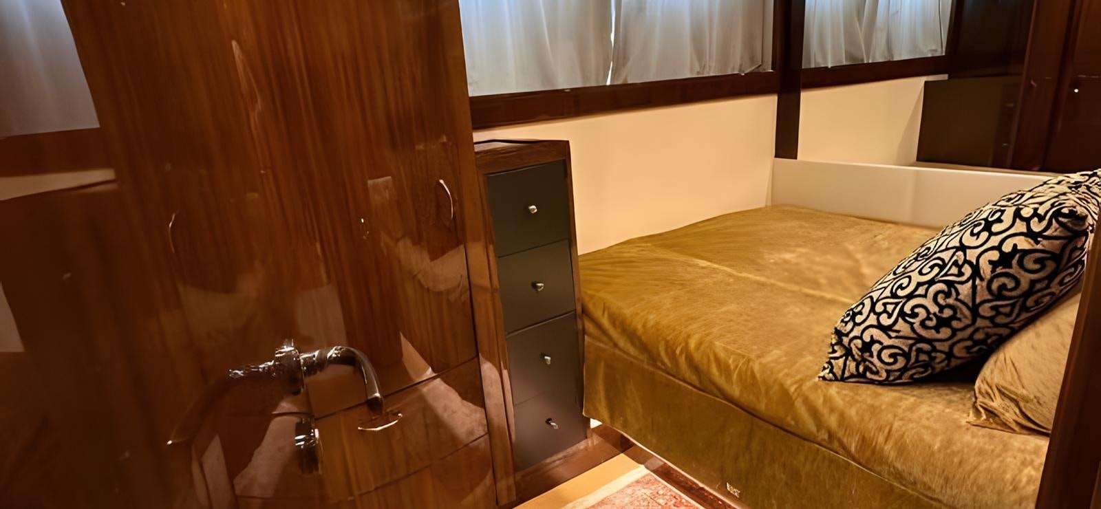 a room with a bed and a window aboard UNICA Yacht for Sale