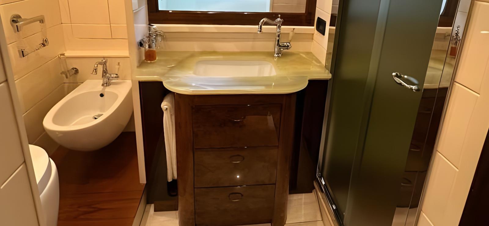 a bathroom with a sink and a mirror aboard UNICA Yacht for Sale