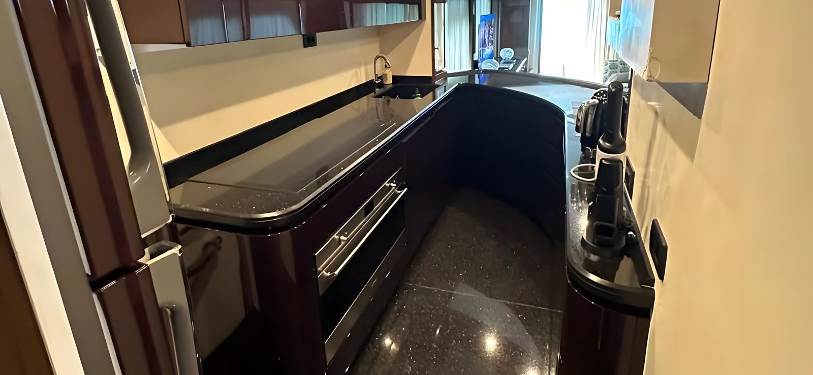 a black treadmill in a room aboard UNICA Yacht for Sale