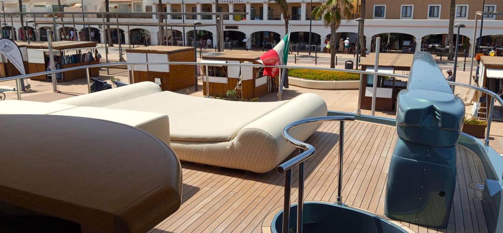 a pool table and chairs outside aboard UNICA Yacht for Sale