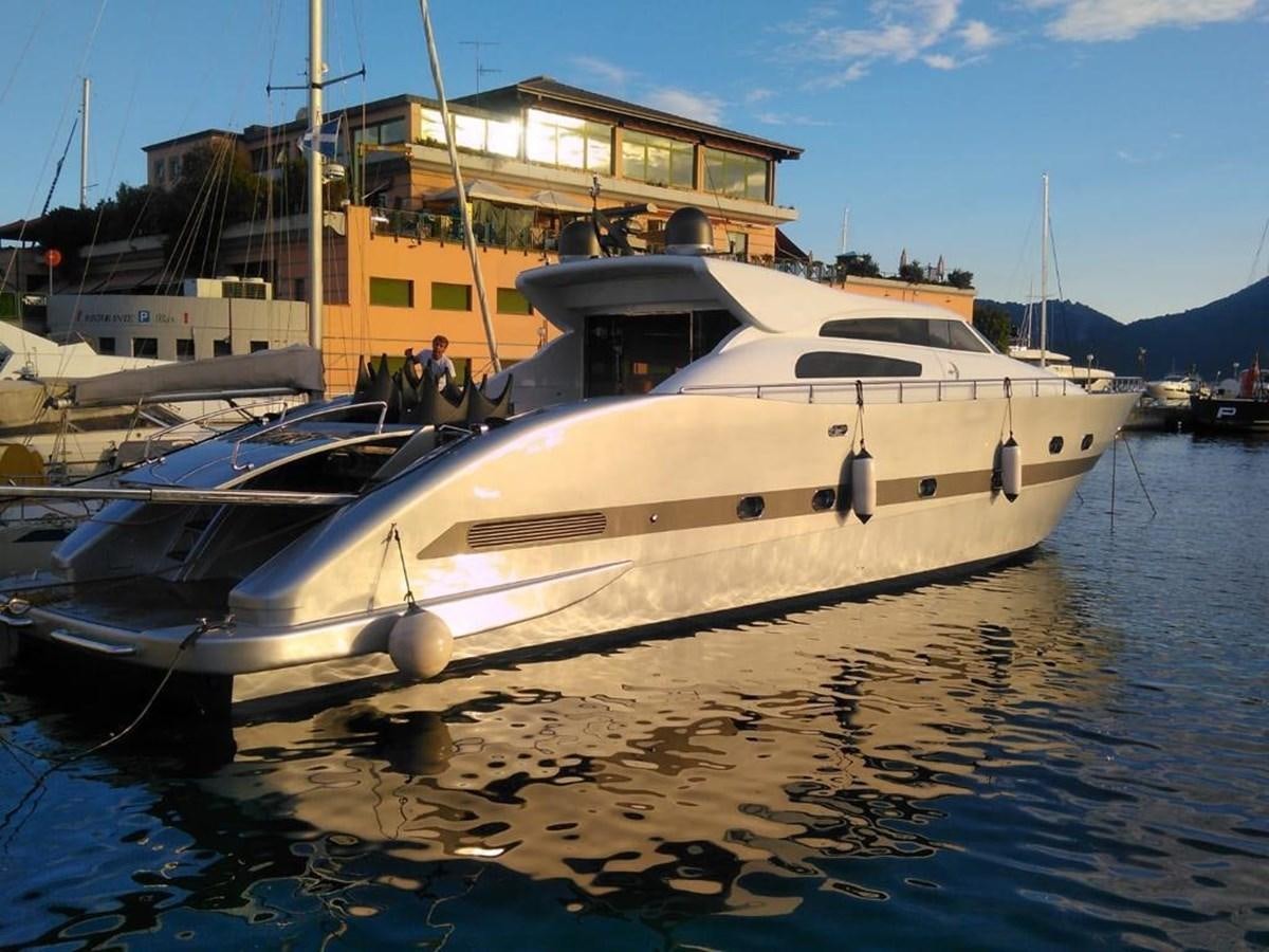 a boat docked at a pier aboard PATHOS Yacht for Sale