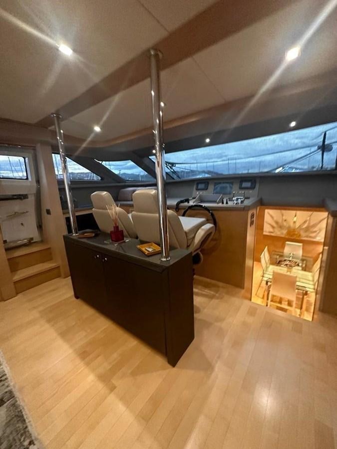 a room with a desk and a guitar aboard PATHOS Yacht for Sale
