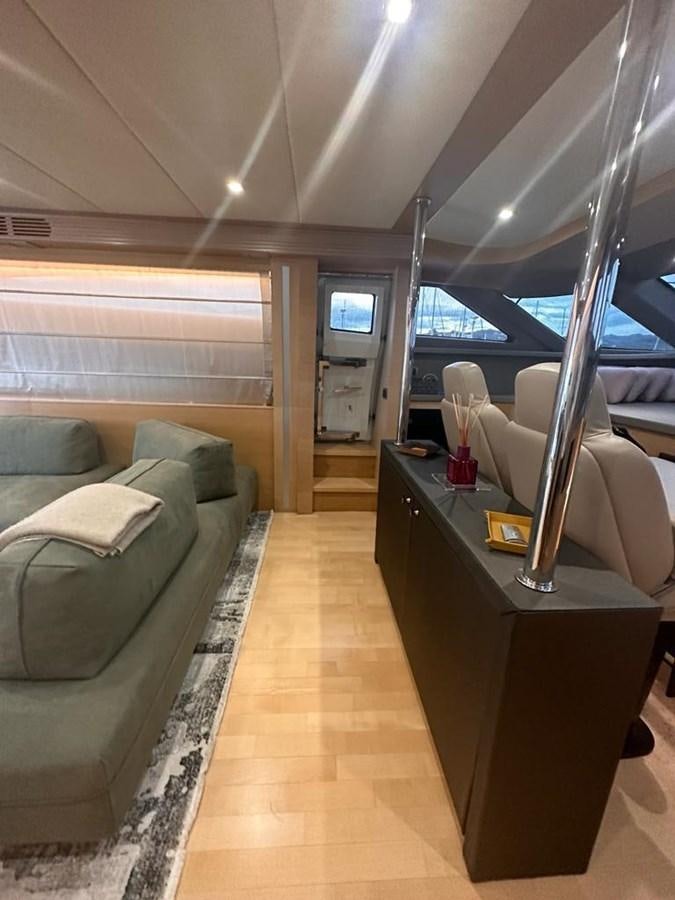 a room with a couch and a table aboard PATHOS Yacht for Sale