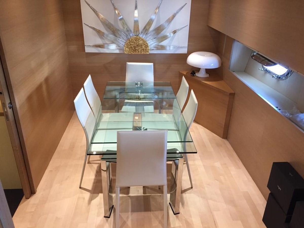 a room with a table and chairs aboard PATHOS Yacht for Sale