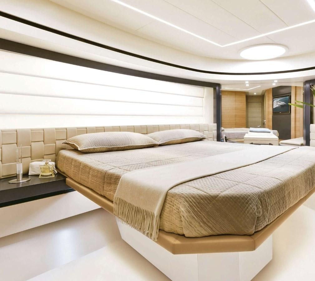a bed with a white sheet aboard HB Yacht for Sale
