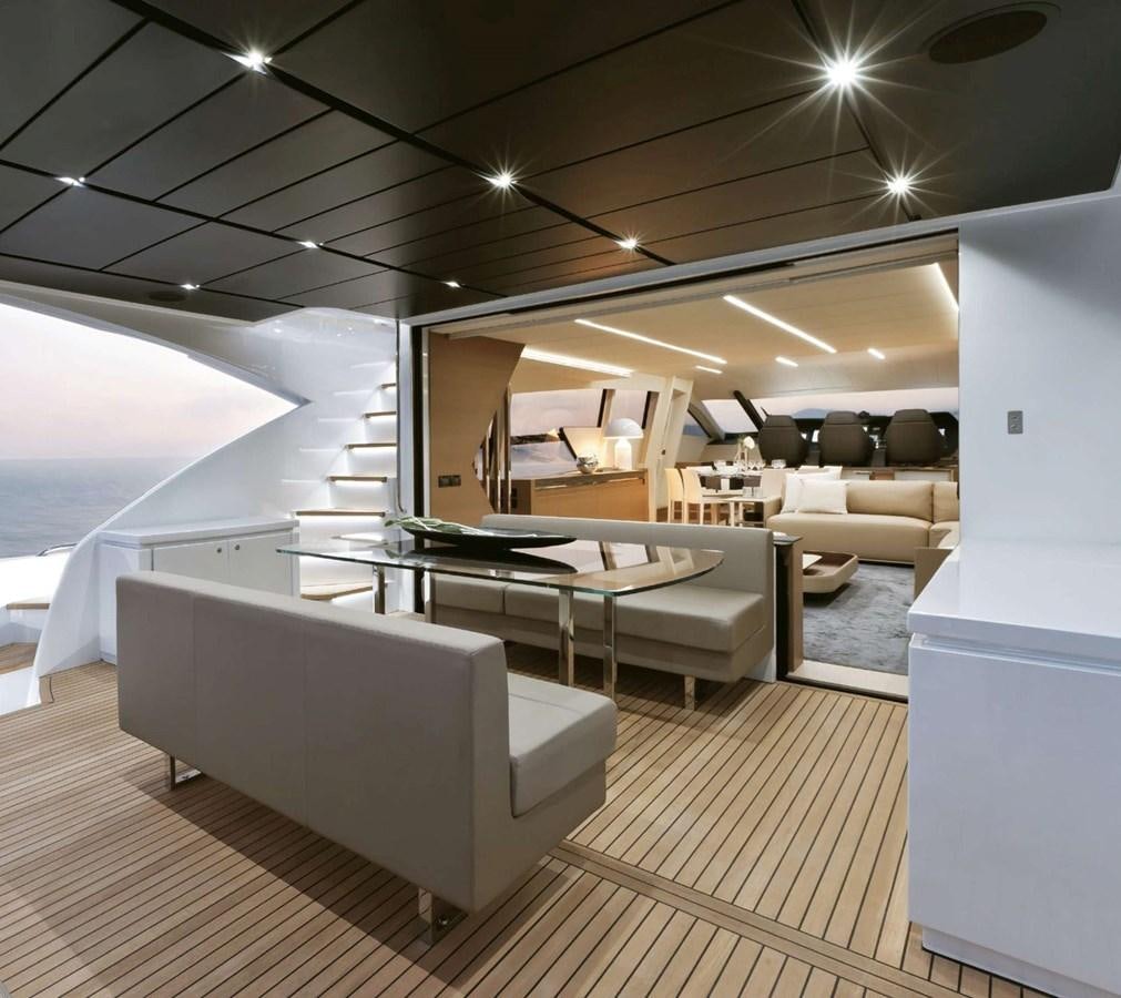 a room with a table and chairs aboard HB Yacht for Sale
