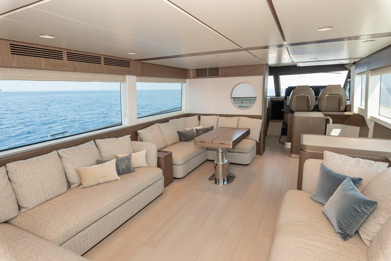 a living room with a large window aboard GREY T Yacht for Sale
