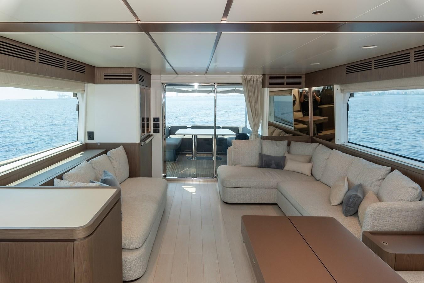 a living room with a large window aboard GREY T Yacht for Sale
