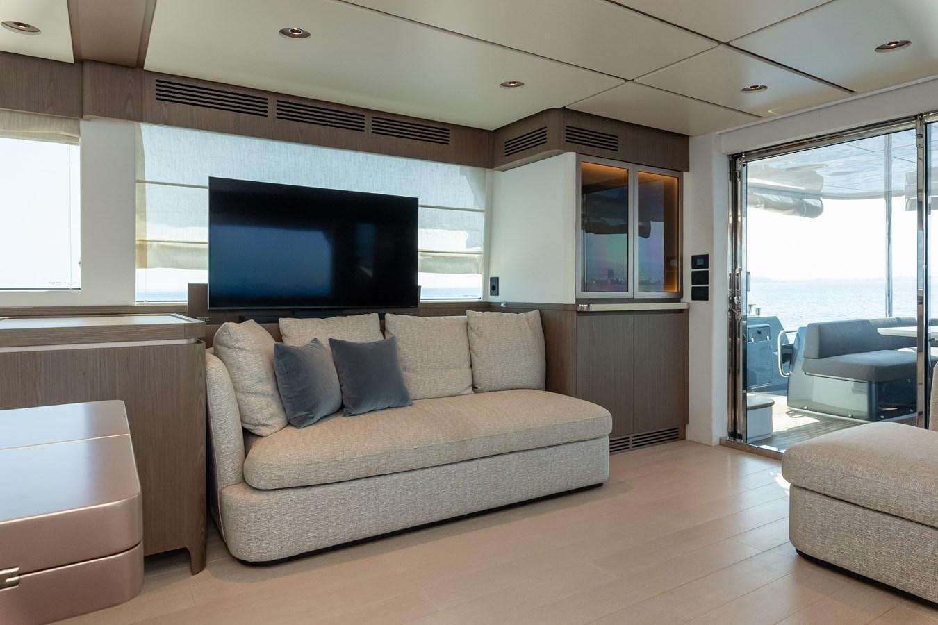 a living room with a couch and a tv aboard GREY T Yacht for Sale