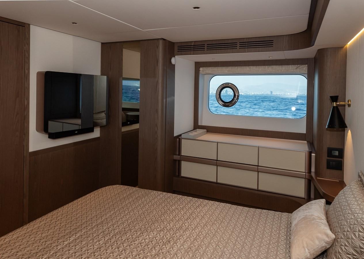 a bed with a large screen aboard GREY T Yacht for Sale