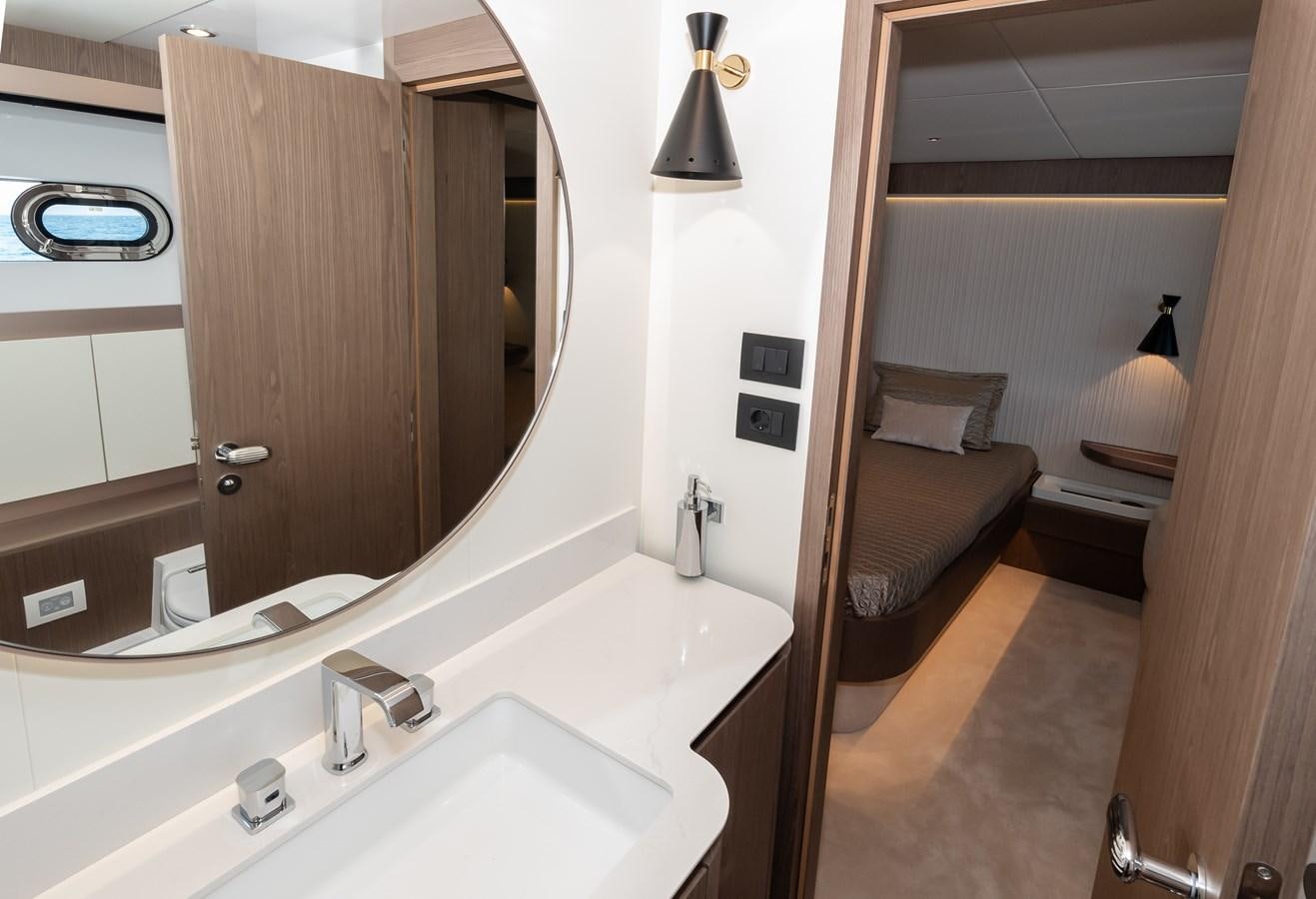 a bathroom with a large mirror aboard GREY T Yacht for Sale