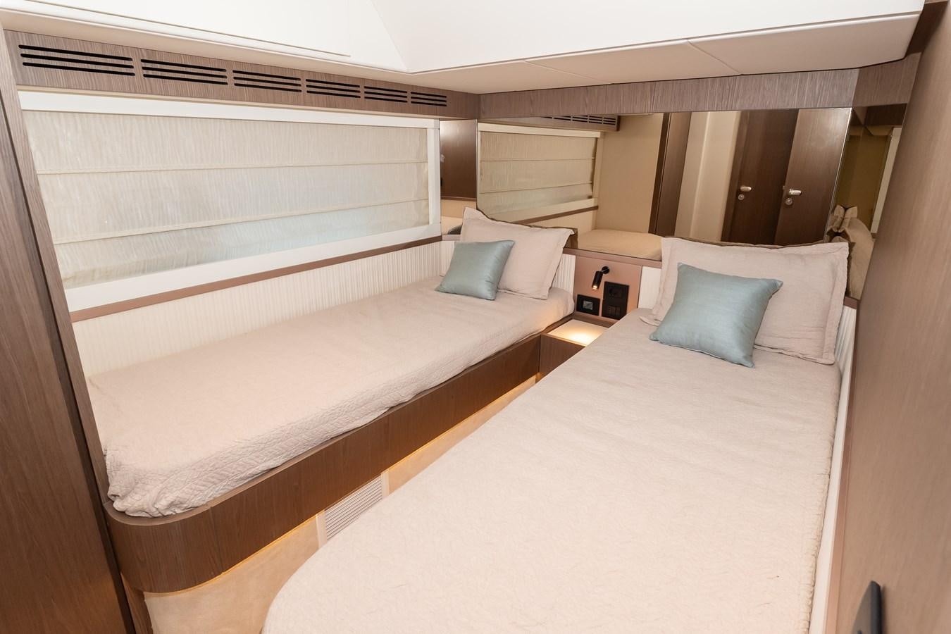 a room with a bed and a window aboard GREY T Yacht for Sale