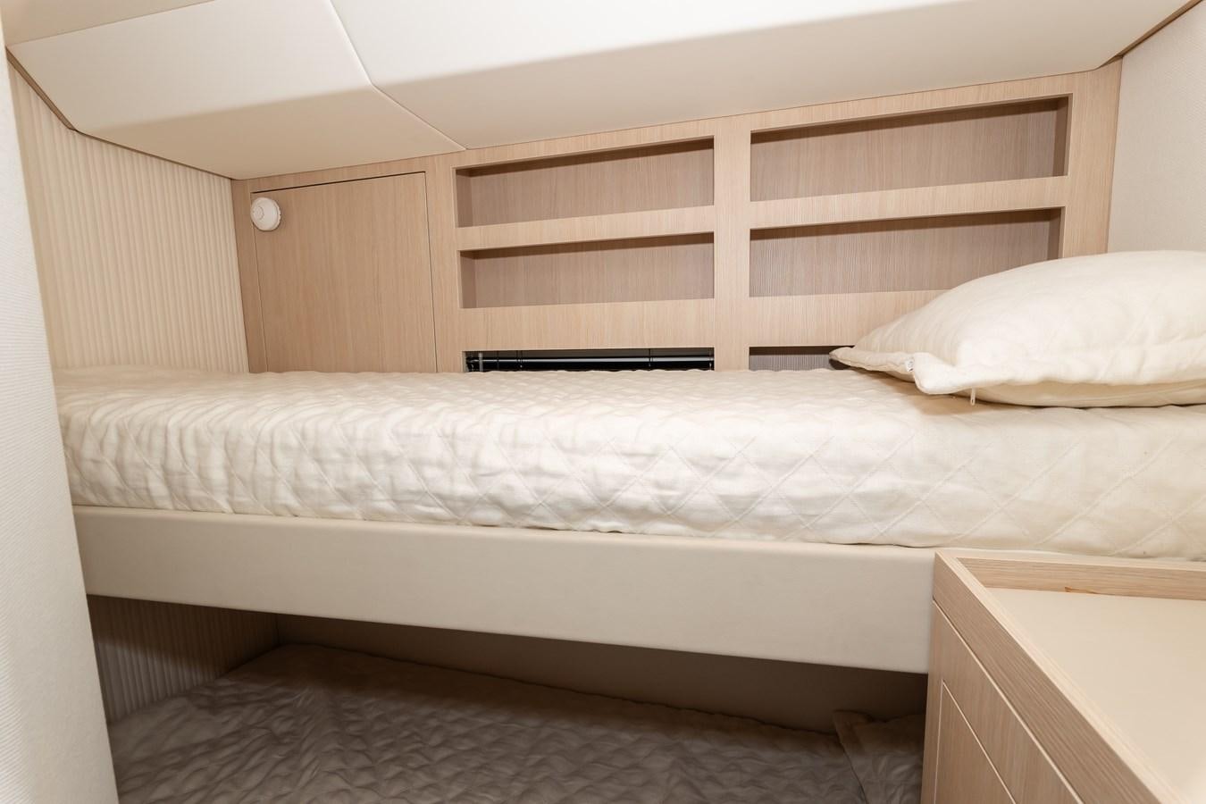 a bed with white sheets aboard GREY T Yacht for Sale