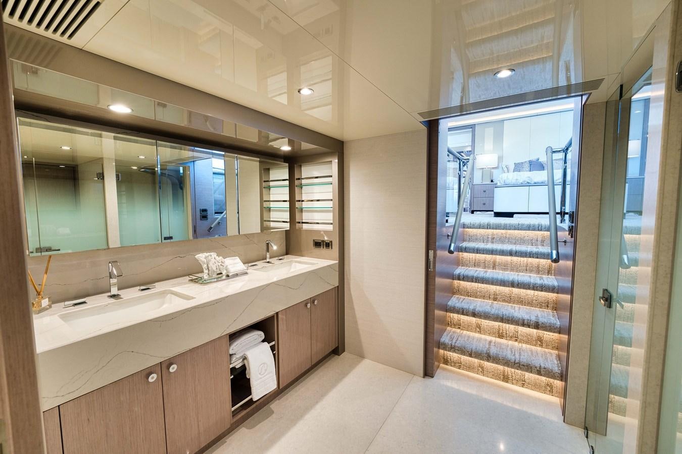 a bathroom with a large mirror aboard OCEAN ALEXANDER 32L11 Yacht for Sale
