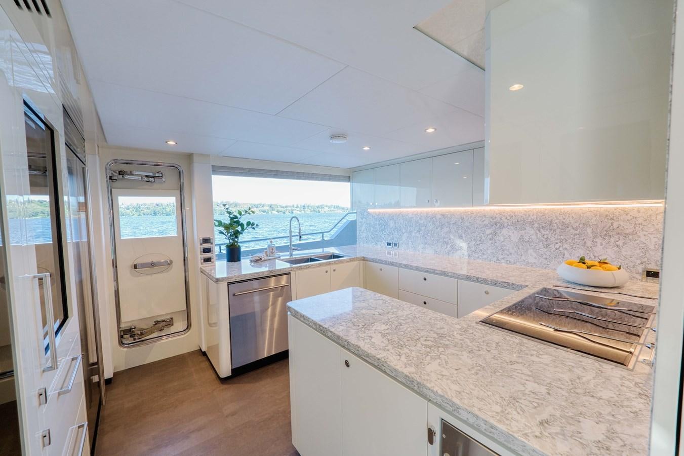 a kitchen with a large window aboard OCEAN ALEXANDER 32L11 Yacht for Sale