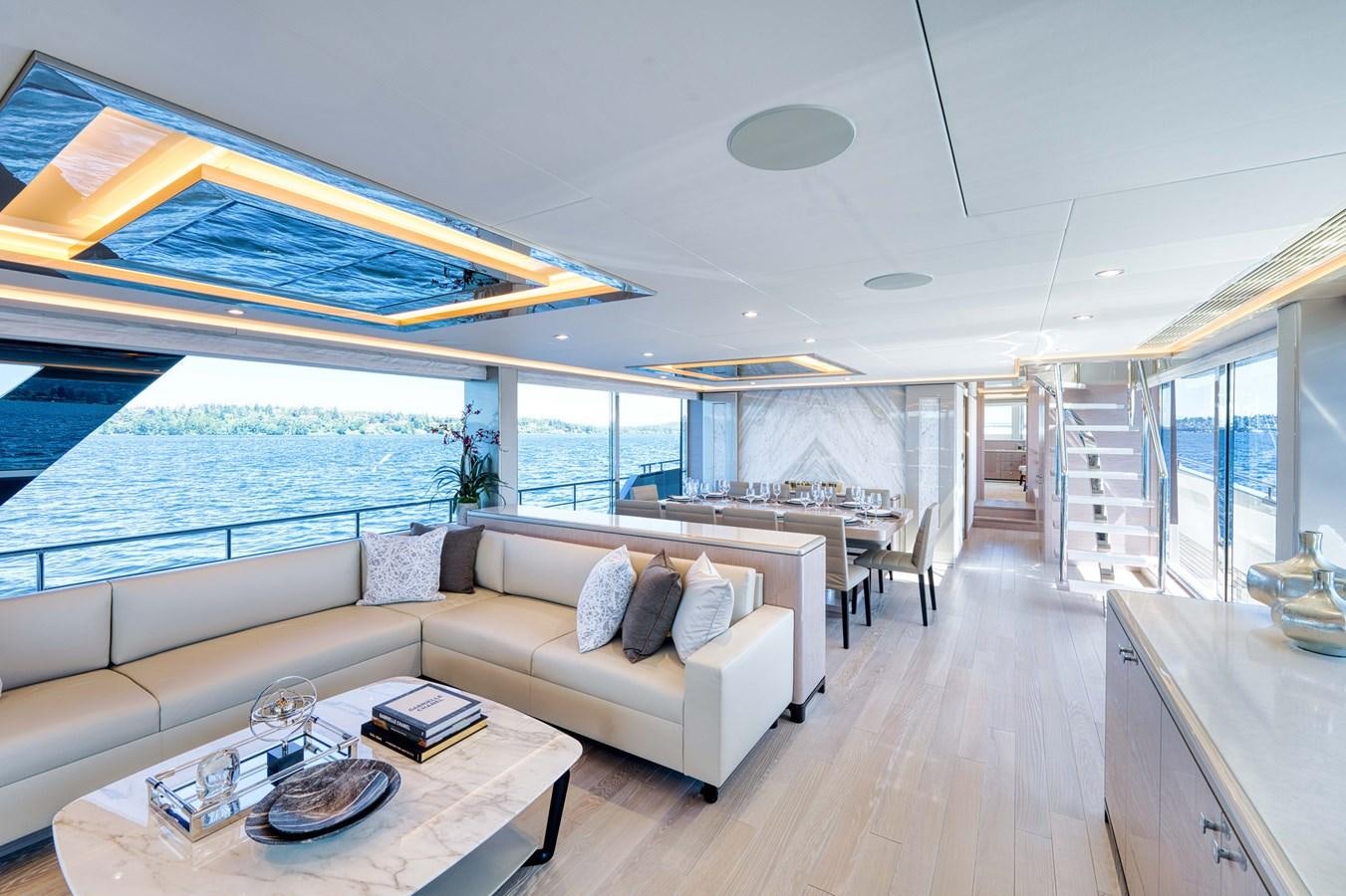 a living room with a large open window aboard OCEAN ALEXANDER 32L11 Yacht for Sale