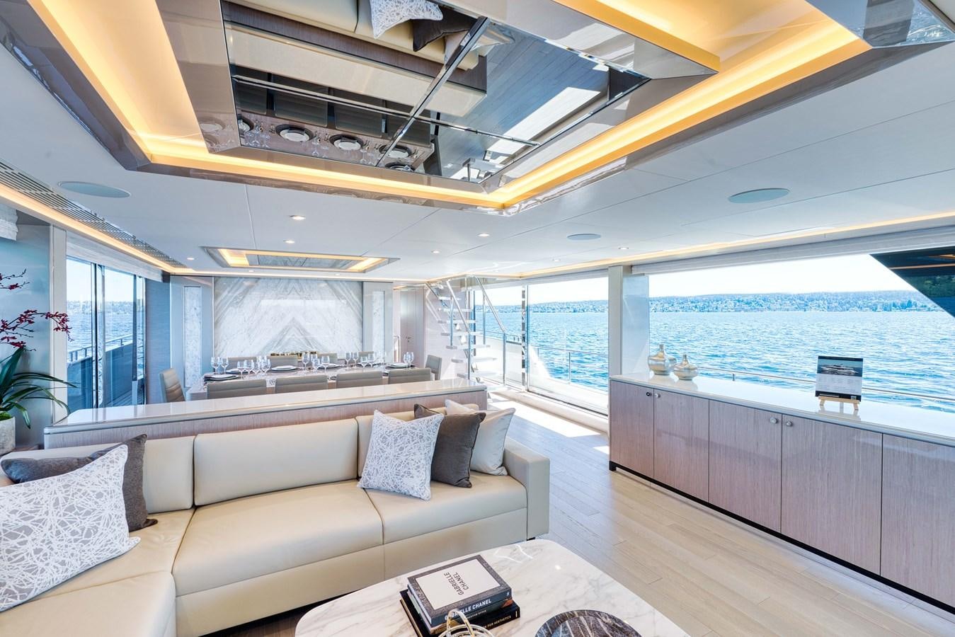 a living room with a large window aboard OCEAN ALEXANDER 32L11 Yacht for Sale