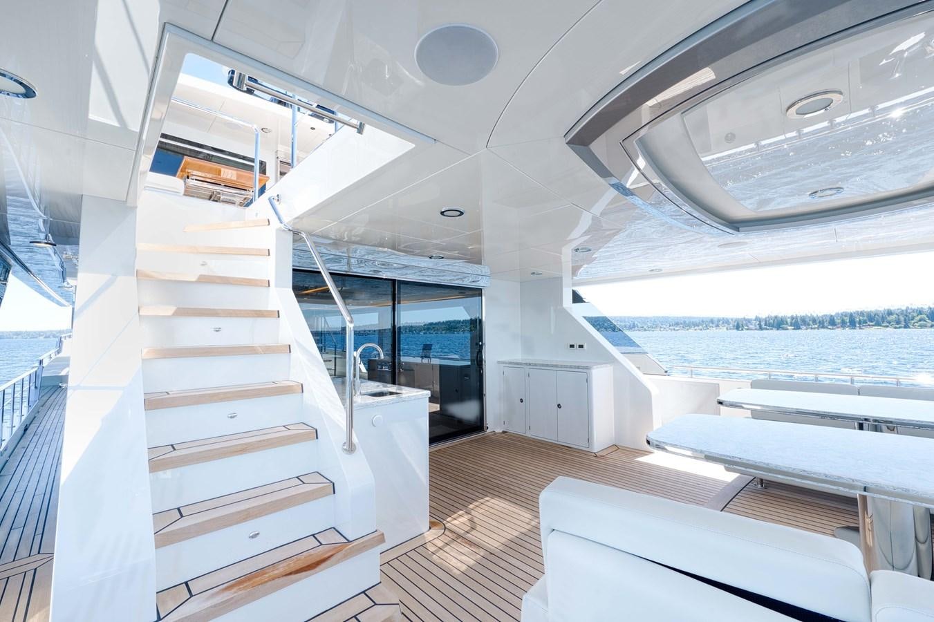 a room with a staircase and a view of the ocean aboard OCEAN ALEXANDER 32L11 Yacht for Sale