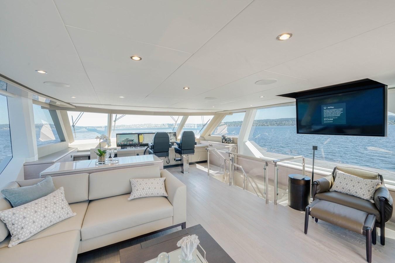 a living room with a large television aboard OCEAN ALEXANDER 32L11 Yacht for Sale
