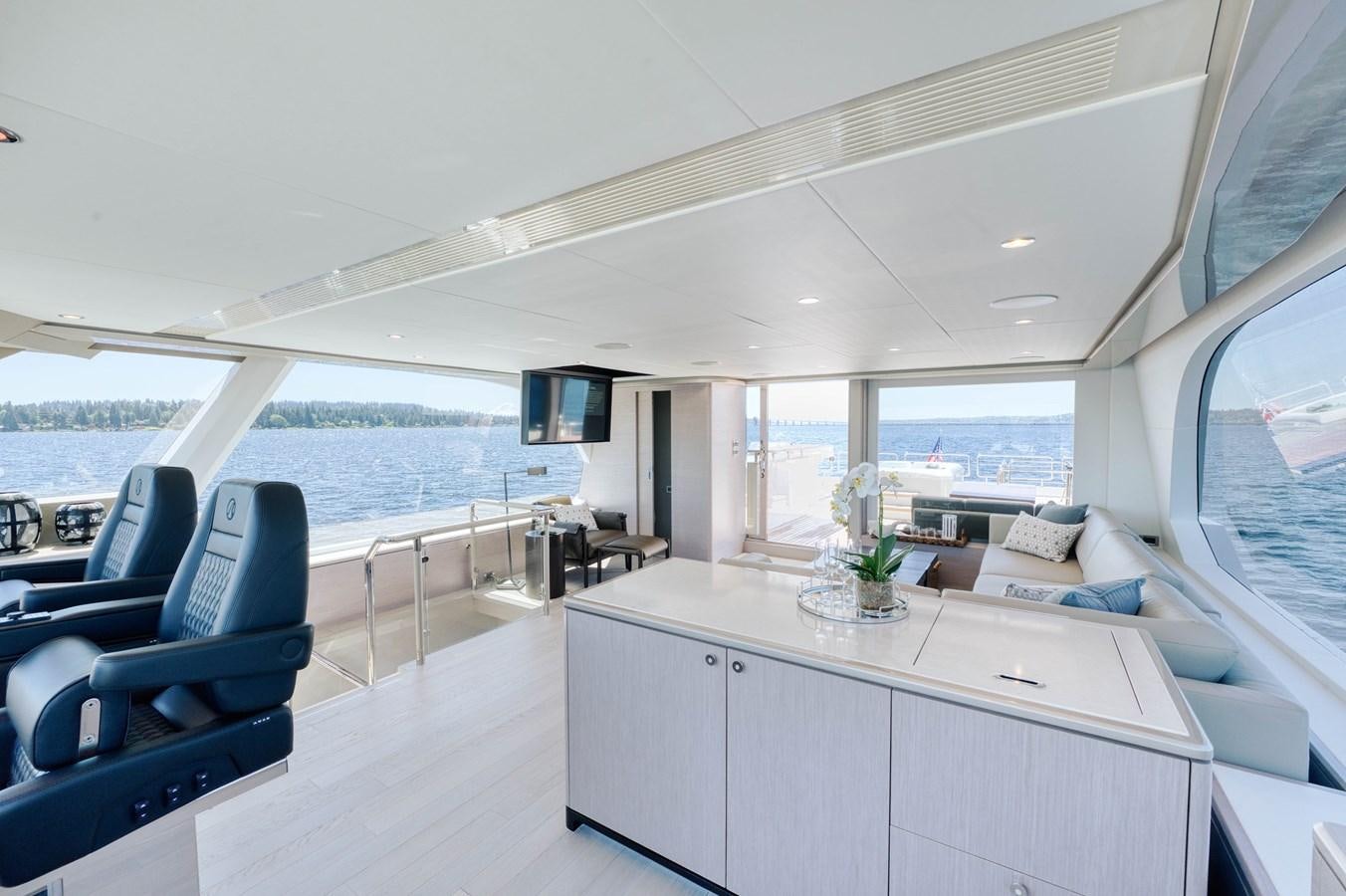a large white room with a large window and a large body of water aboard OCEAN ALEXANDER 32L11 Yacht for Sale