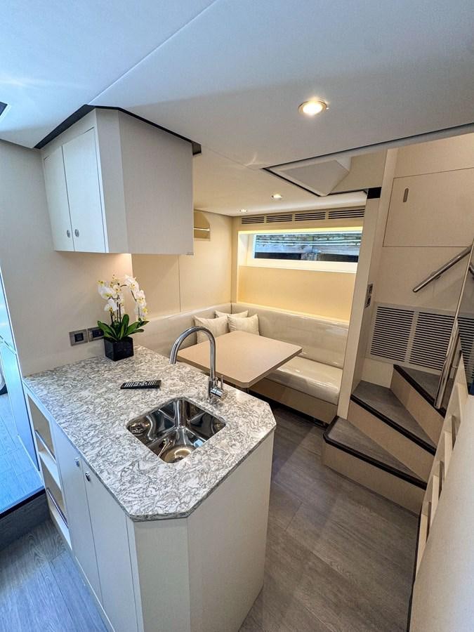 a large bathroom with a marble counter top aboard OCEAN ALEXANDER 32L11 Yacht for Sale