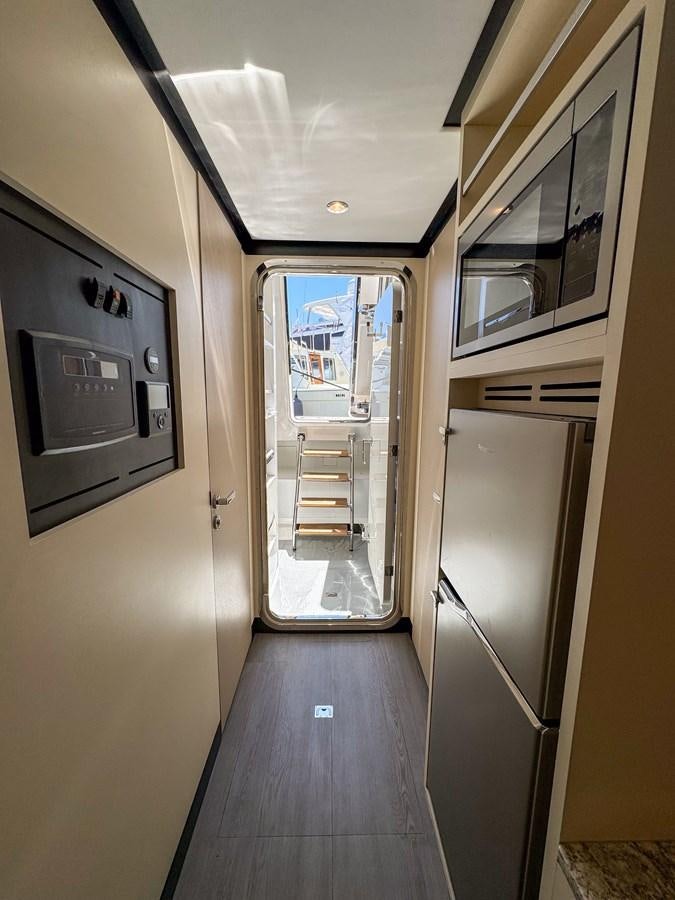 a hallway with a glass door aboard OCEAN ALEXANDER 32L11 Yacht for Sale