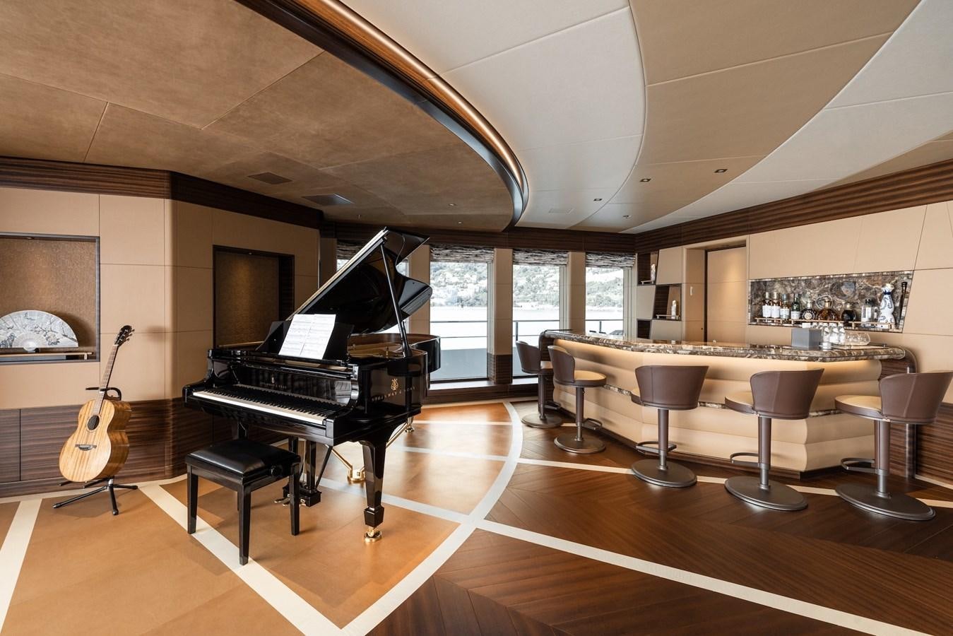 a piano in a room aboard ENERGY Yacht for Sale