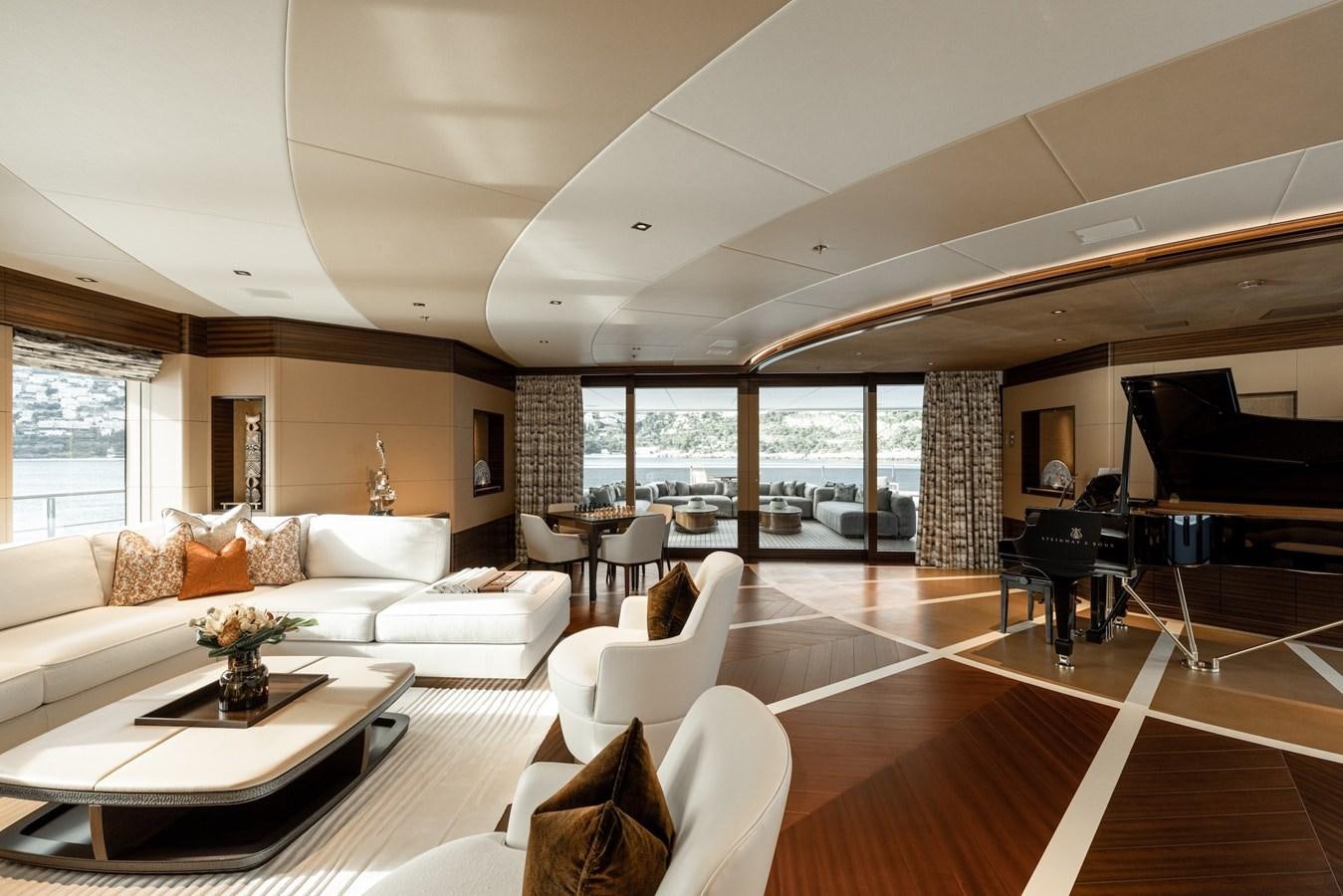 a living room with a piano and a piano aboard ENERGY Yacht for Sale