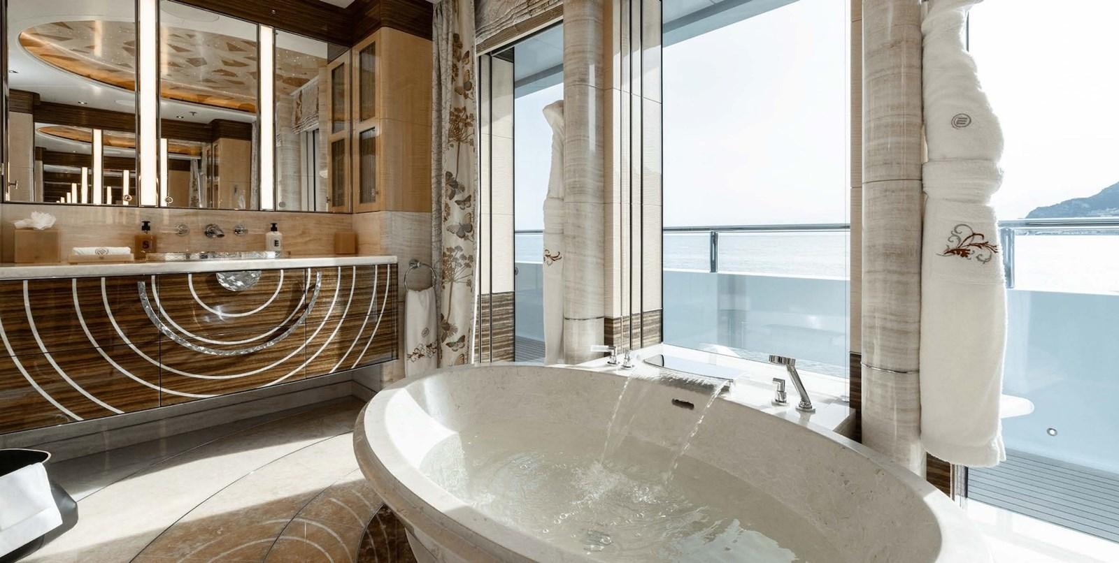 a large bathtub in a bathroom aboard ENERGY Yacht for Sale