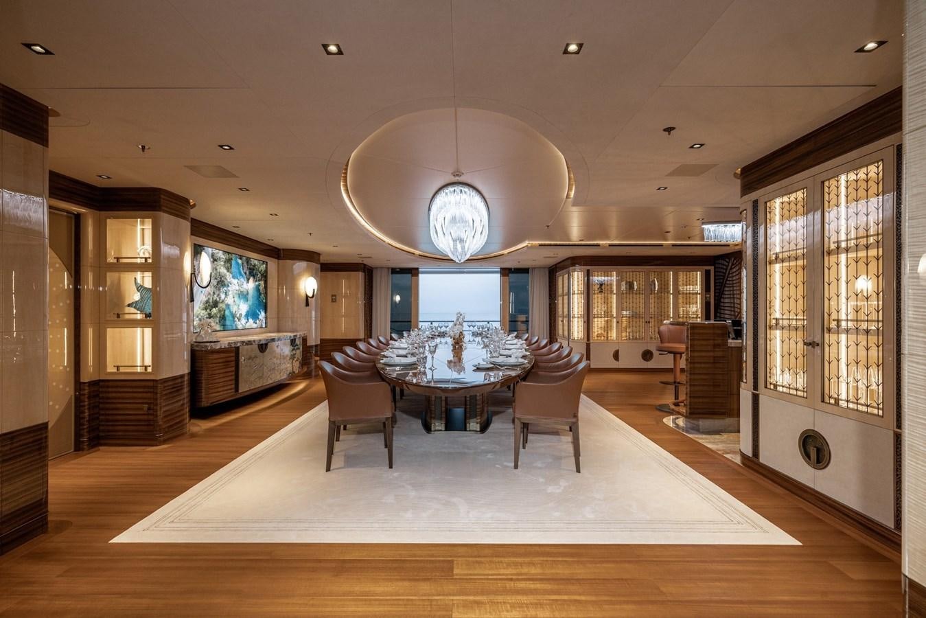 a large living room with a large chandelier aboard ENERGY Yacht for Sale