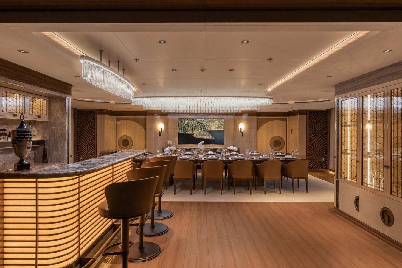 a large room with a table and chairs aboard ENERGY Yacht for Sale