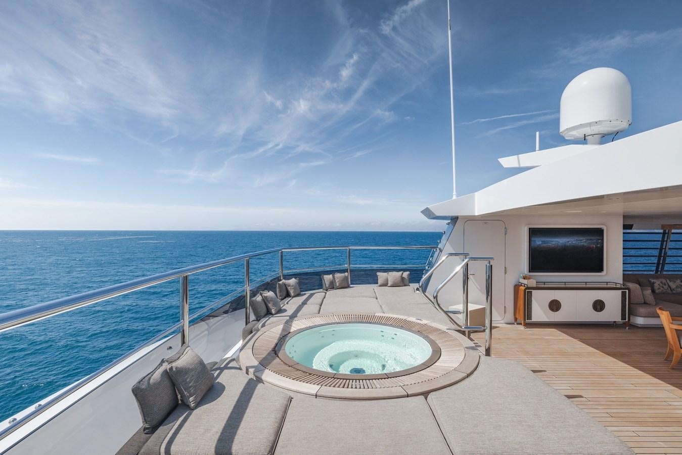 a large swimming pool on a deck aboard ENERGY Yacht for Sale
