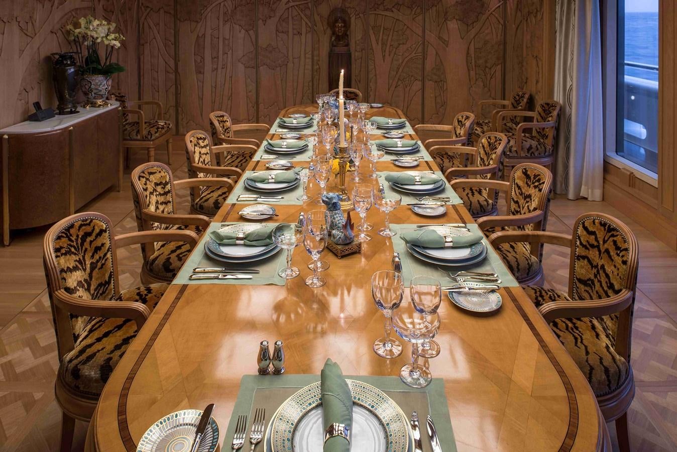 a dining table set for a dinner aboard AURORA Yacht for Sale