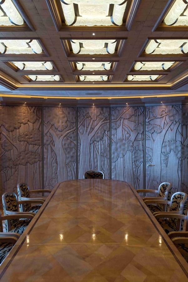 a room with a table and chairs aboard AURORA Yacht for Sale