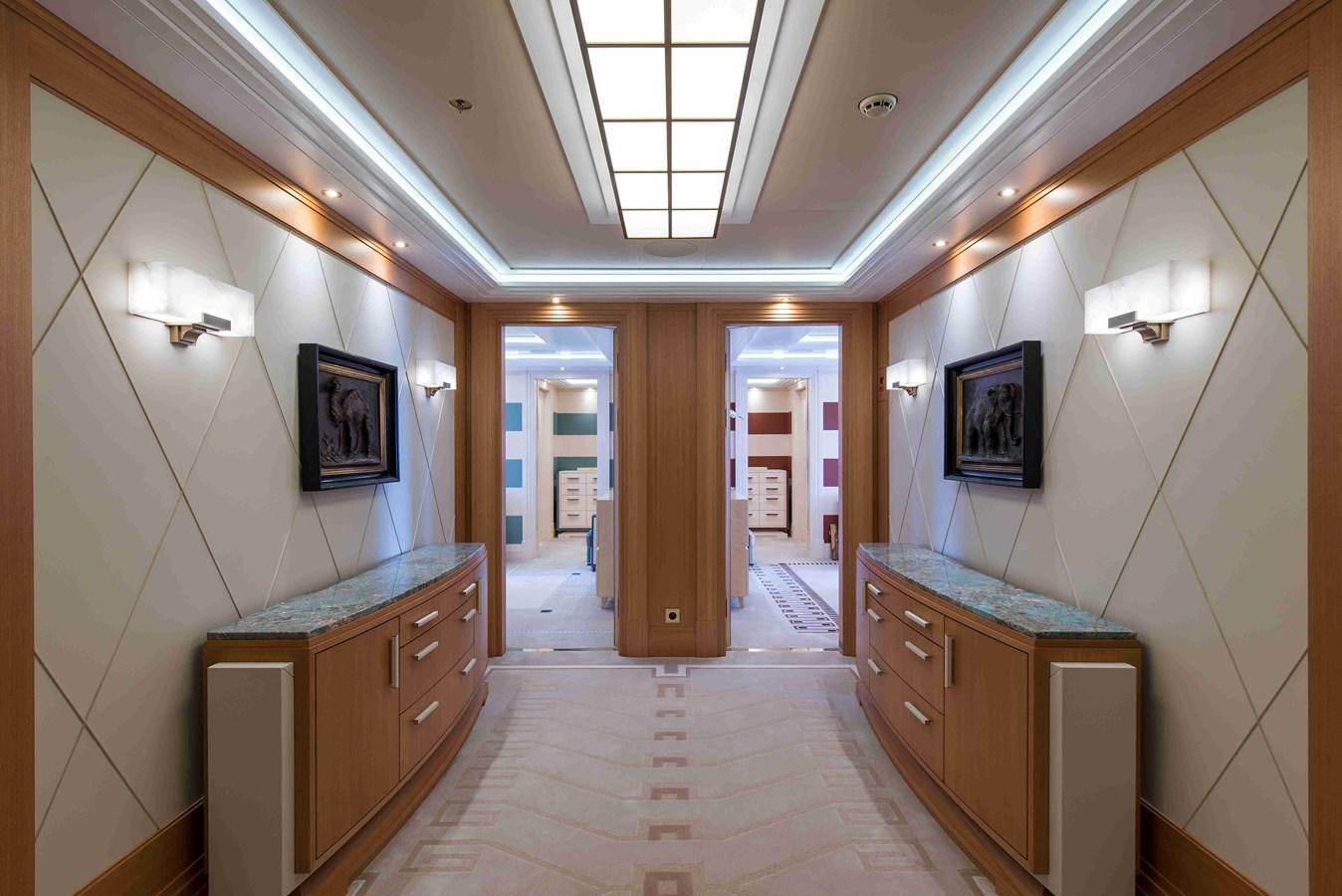 a room with a wood floor and a large mirror aboard AURORA Yacht for Sale