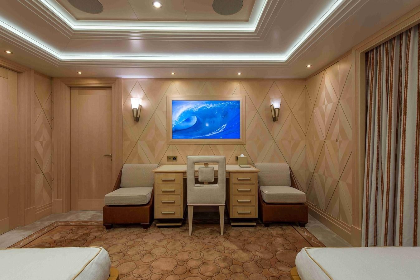 a room with a desk and chairs aboard AURORA Yacht for Sale