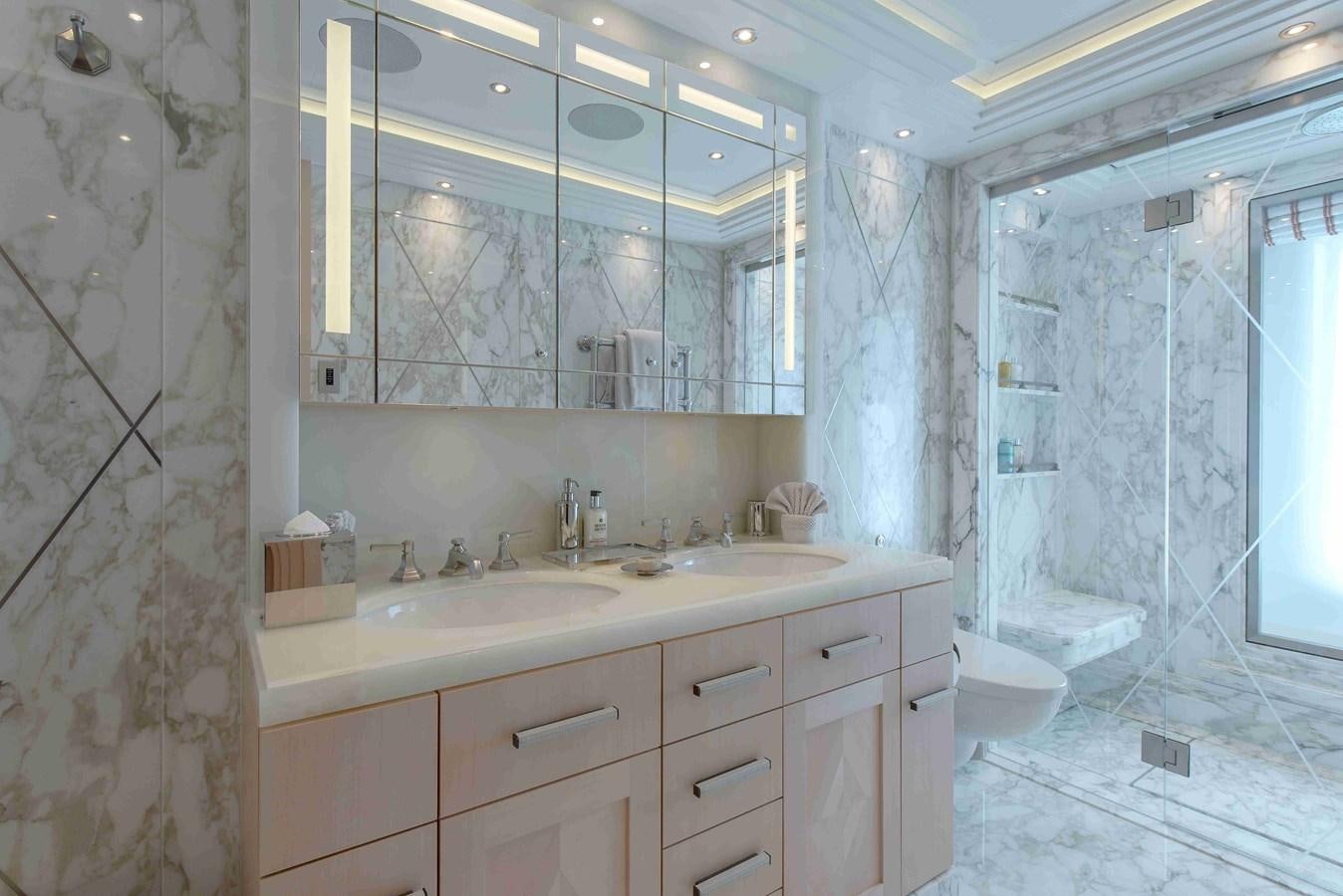 a bathroom with a large mirror aboard AURORA Yacht for Sale