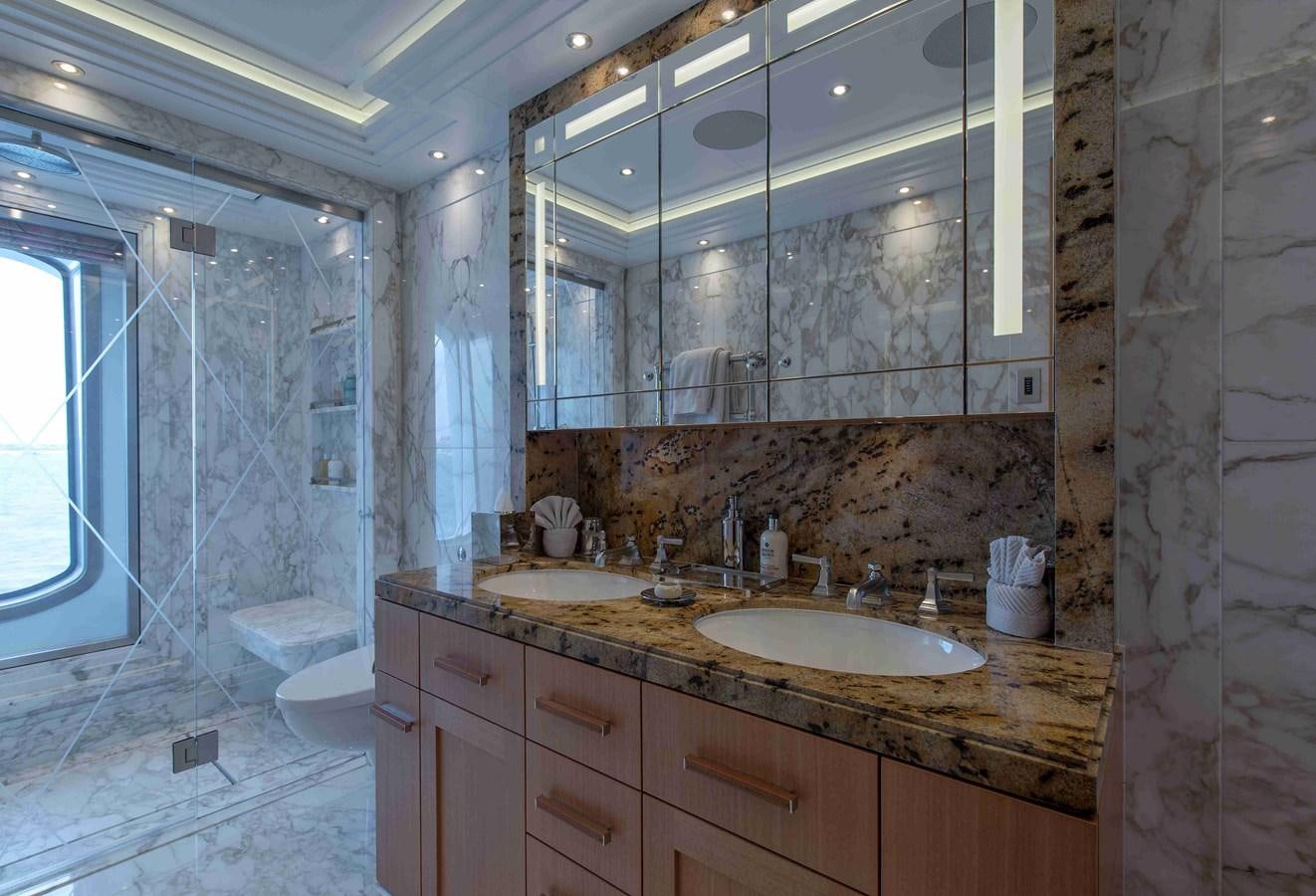 a bathroom with a large mirror aboard AURORA Yacht for Sale
