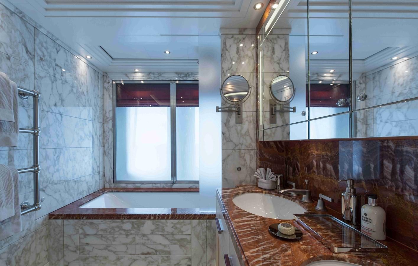a bathroom with a sink and a mirror aboard AURORA Yacht for Sale