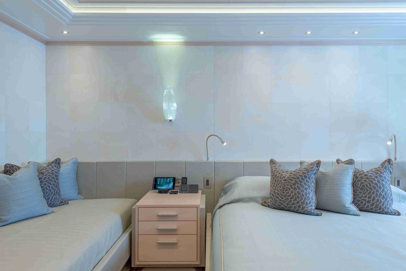 a room with a bed and a desk aboard AURORA Yacht for Sale