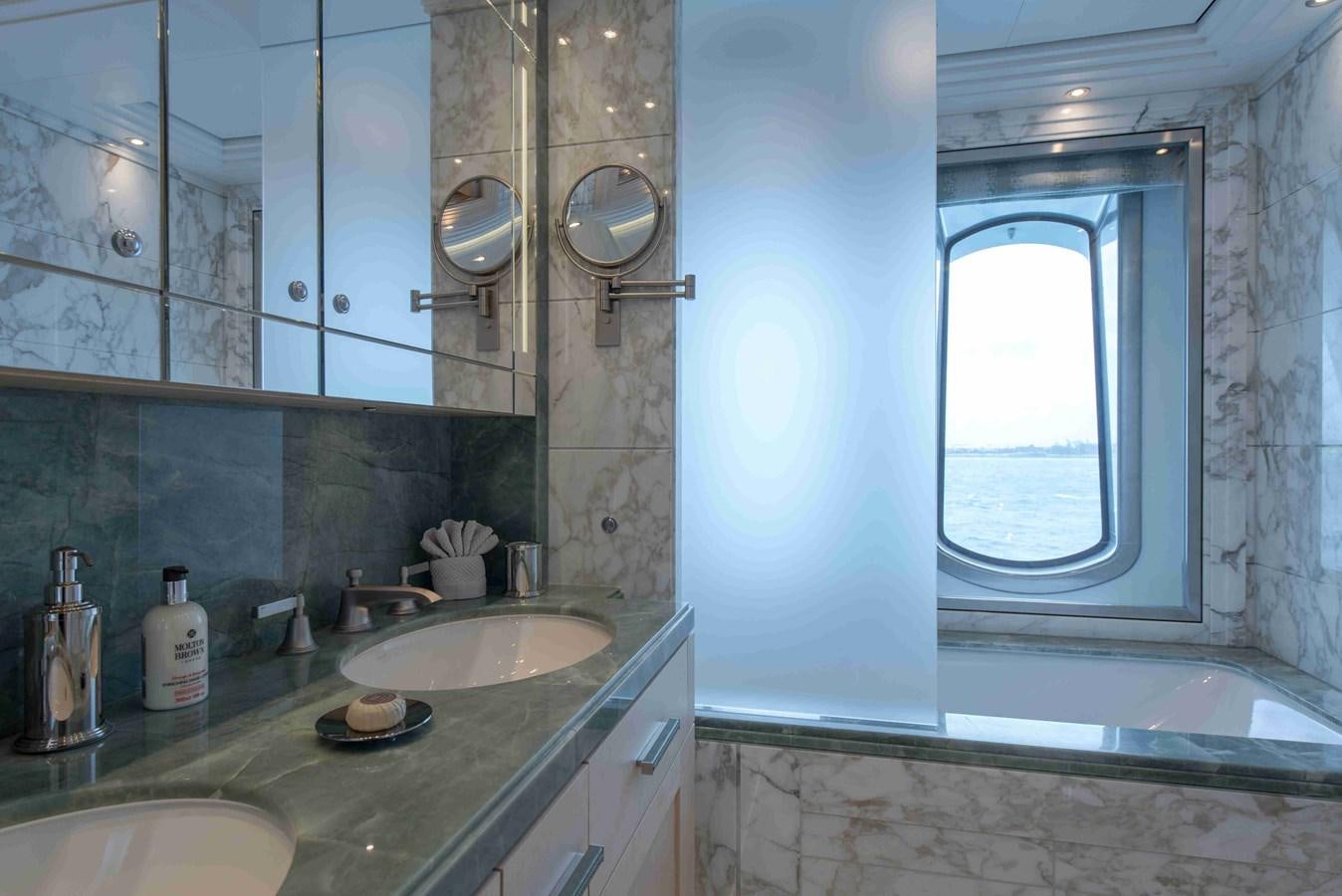 a bathroom with a sink and a window aboard AURORA Yacht for Sale