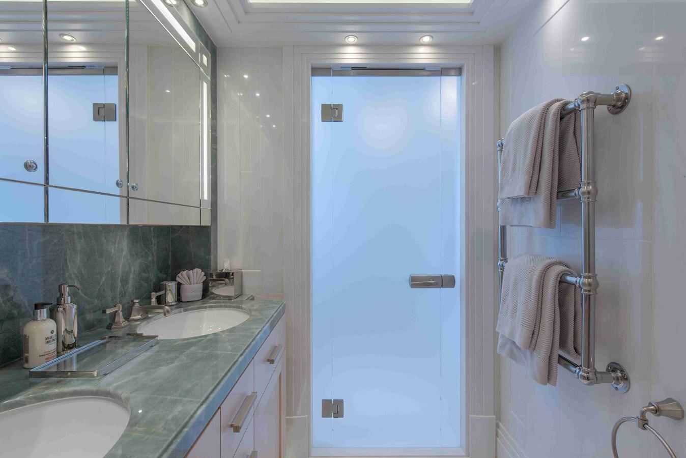 a bathroom with a sink and a shower unit aboard AURORA Yacht for Sale