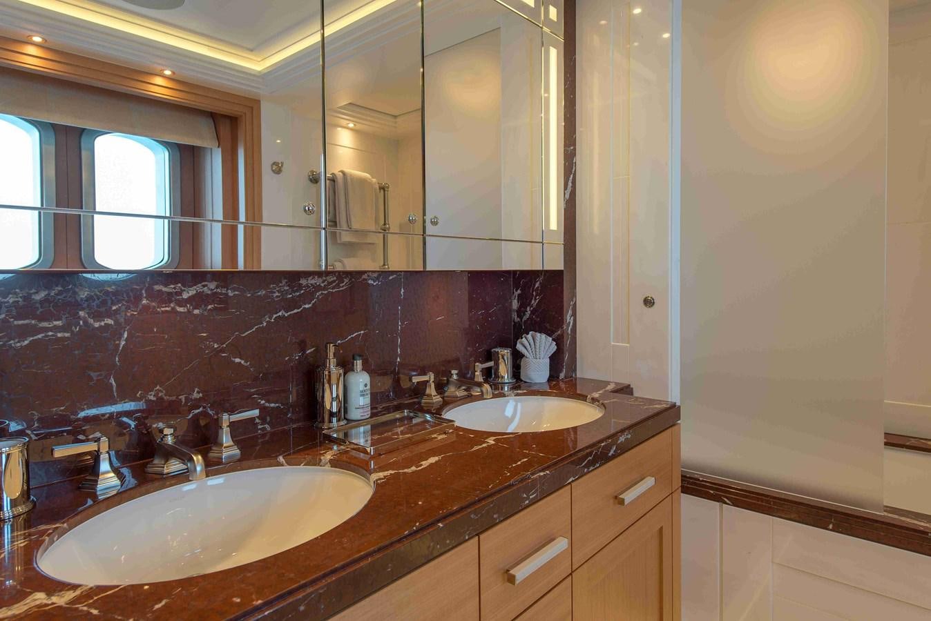 a bathroom with two sinks aboard AURORA Yacht for Sale