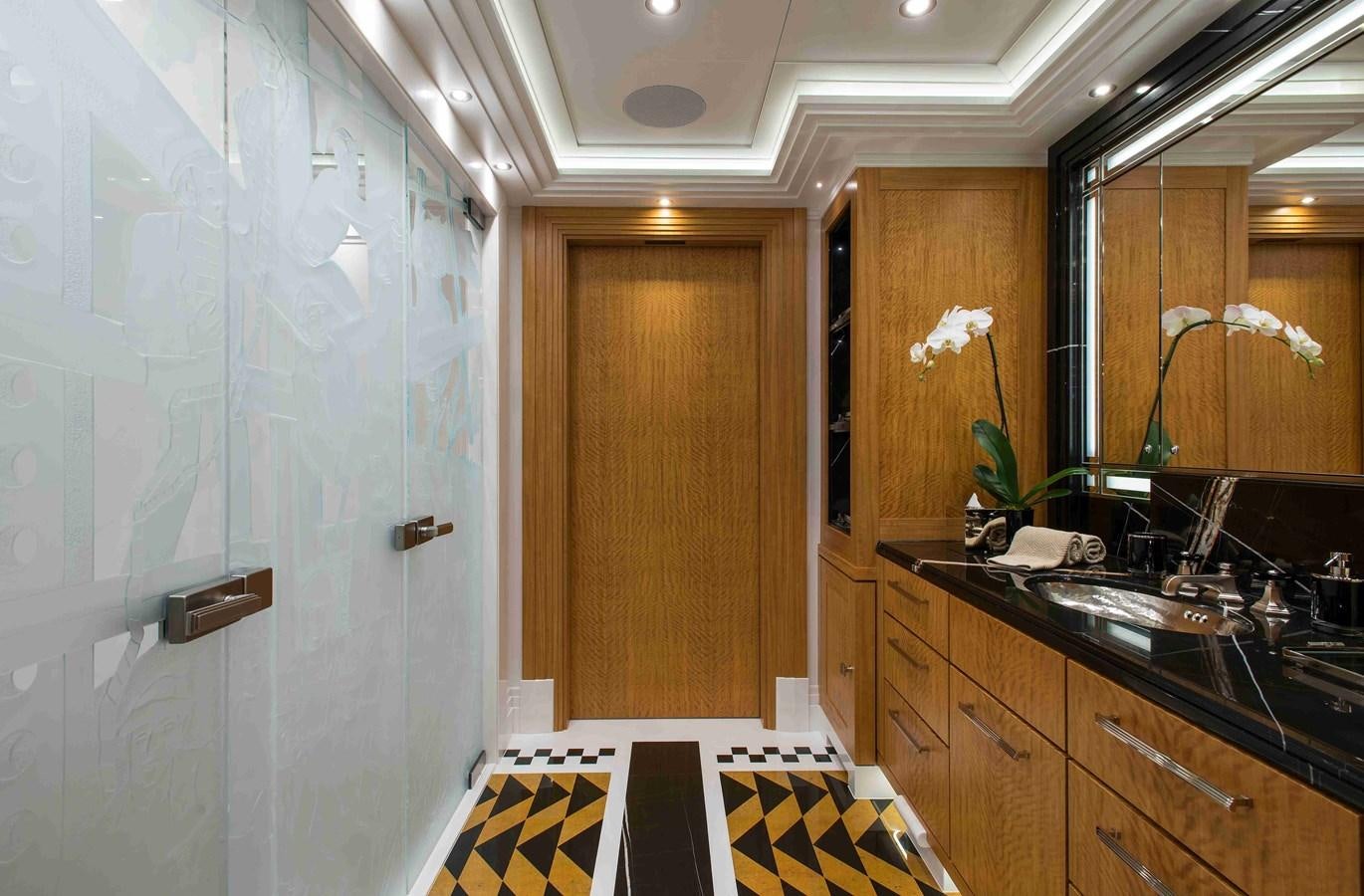 a bathroom with a sink and a mirror aboard AURORA Yacht for Sale