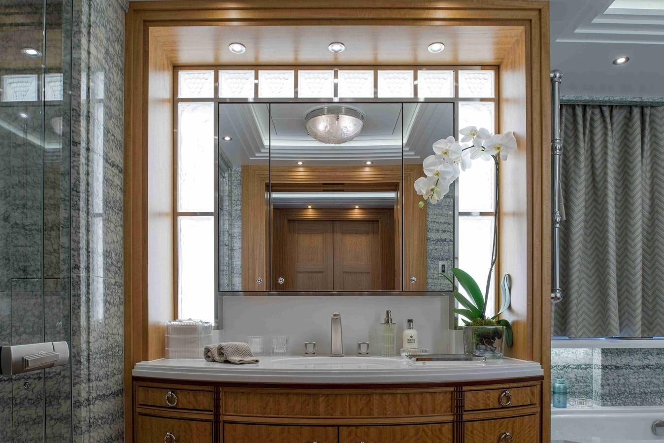 a bathroom with a large mirror aboard AURORA Yacht for Sale