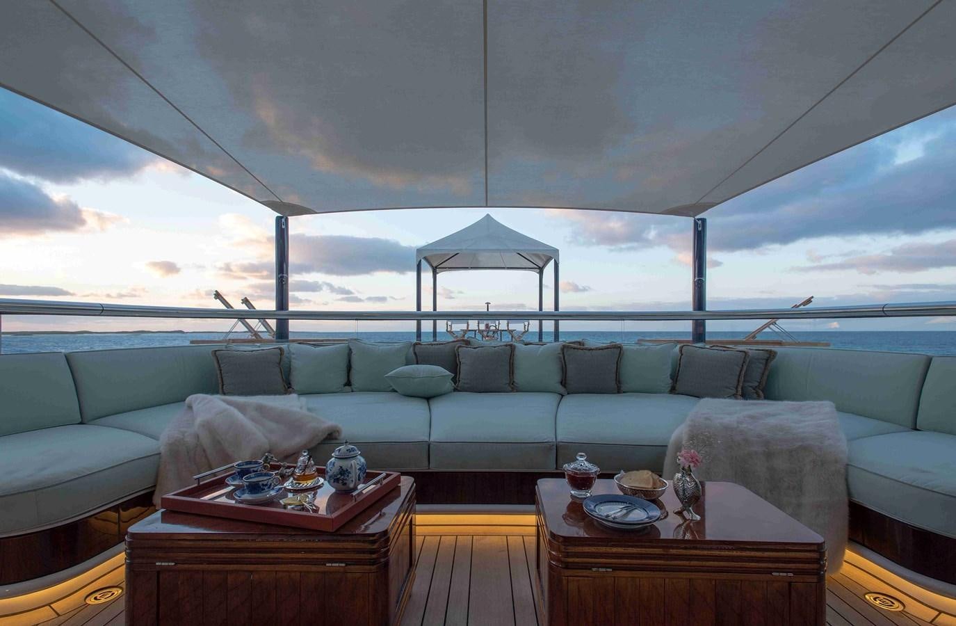 a living room with a large glass window aboard AURORA Yacht for Sale