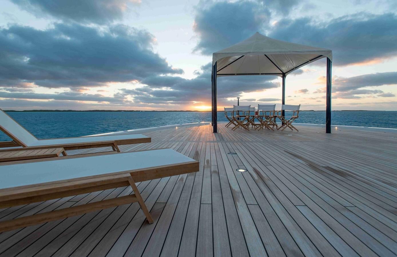 a dock with a covered umbrella aboard AURORA Yacht for Sale