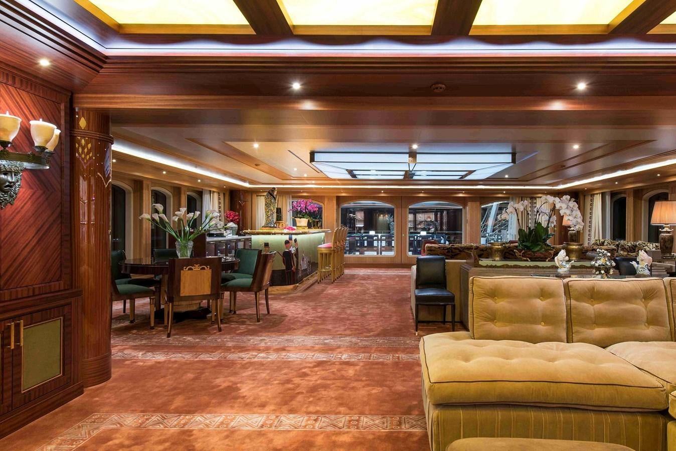 a room with a table chairs and a large window aboard AURORA Yacht for Sale